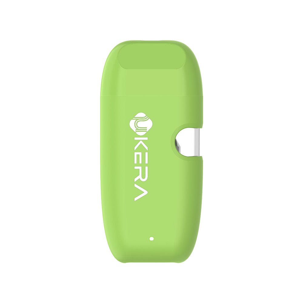 Side angle of the lime green uKERA G189 Cobi disposable vape lying flat, highlighting the bottom USB-C charging port, oil intake window, and ultra-compact ergonomic casing.